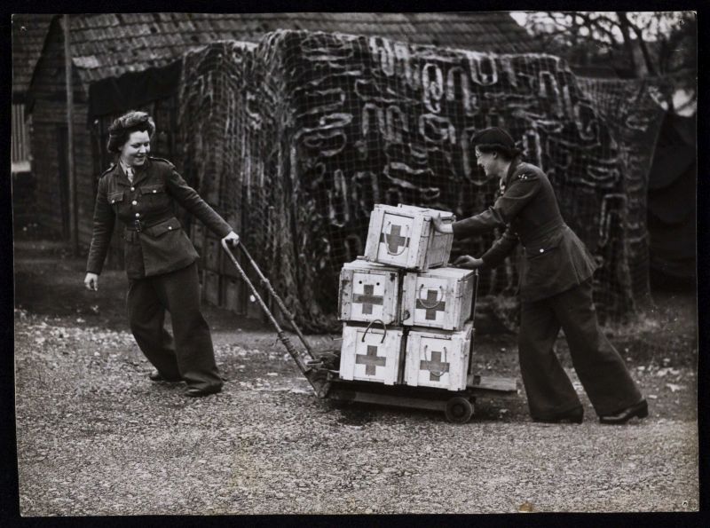 ATS personnel moving crates of blood.