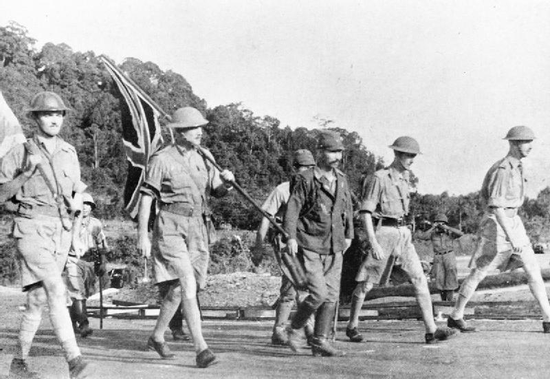 Lieutenant-General Percival and his party carry the Union flag on their way to surrender Singapore to the Japanese